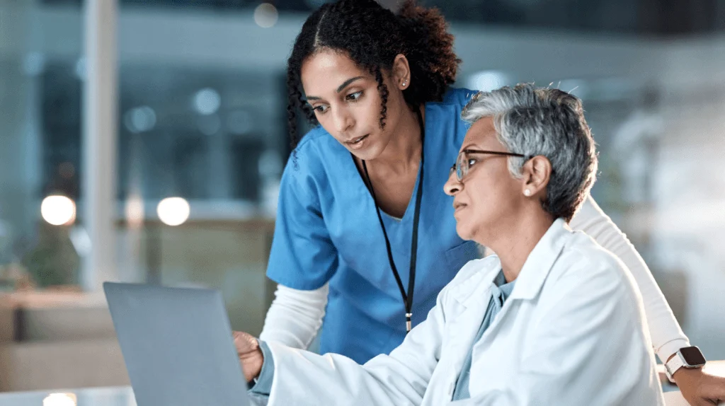 Healthcare team coordinating patient care with PulseNet365 on Dynamics 365